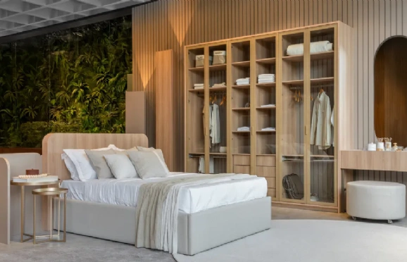 O uso de curvas no mobiliário planejado valoriza o espaço e transforma o ambiente em um refúgio sofisticado. Créditos: Roberta Gewehr